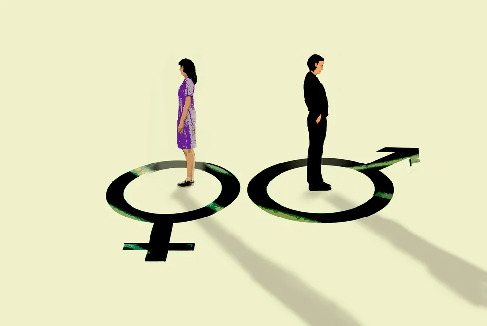 여성과 남성 성별 기호 위에 각각 서 있는 두 사람의 모습입니다. 이는 젠더 갈등 또는 성별 간의 차이를 시각적으로 표현한 것입니다.